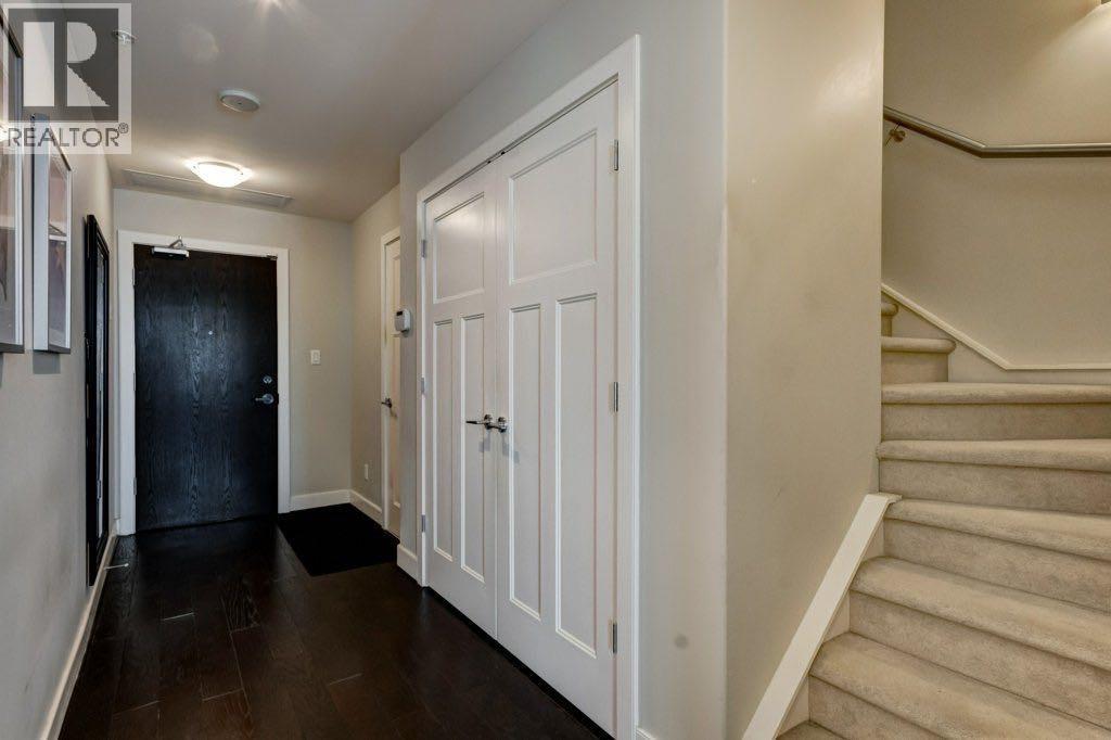 Main floor entry & stairs to 2nd level - 602, 99 Spruce Place Sw, Calgary, AB - Indoor Photo Showing Other Room