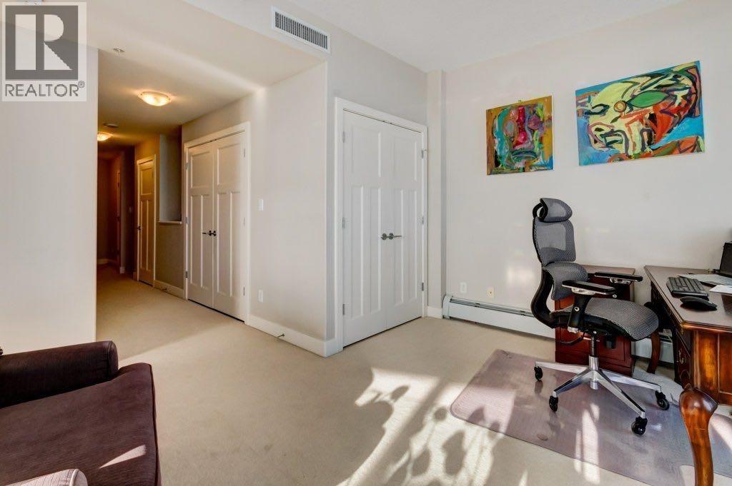 upper level with 2nd entry/exit to elevators - 602, 99 Spruce Place Sw, Calgary, AB - Indoor Photo Showing Office