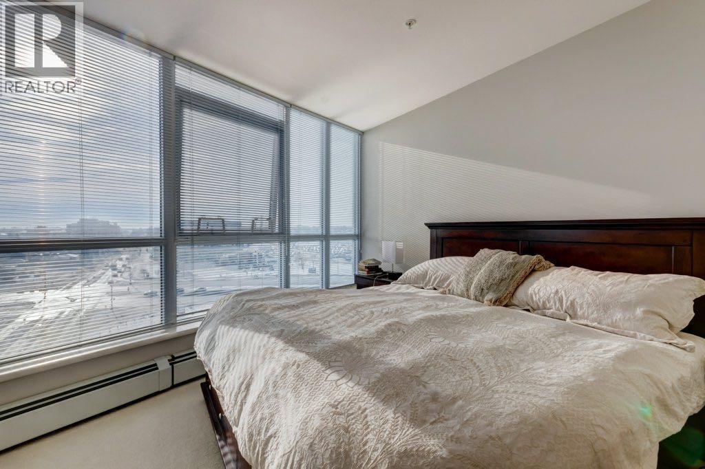 Primary bedroom upper level - 602, 99 Spruce Place Sw, Calgary, AB - Indoor Photo Showing Bedroom