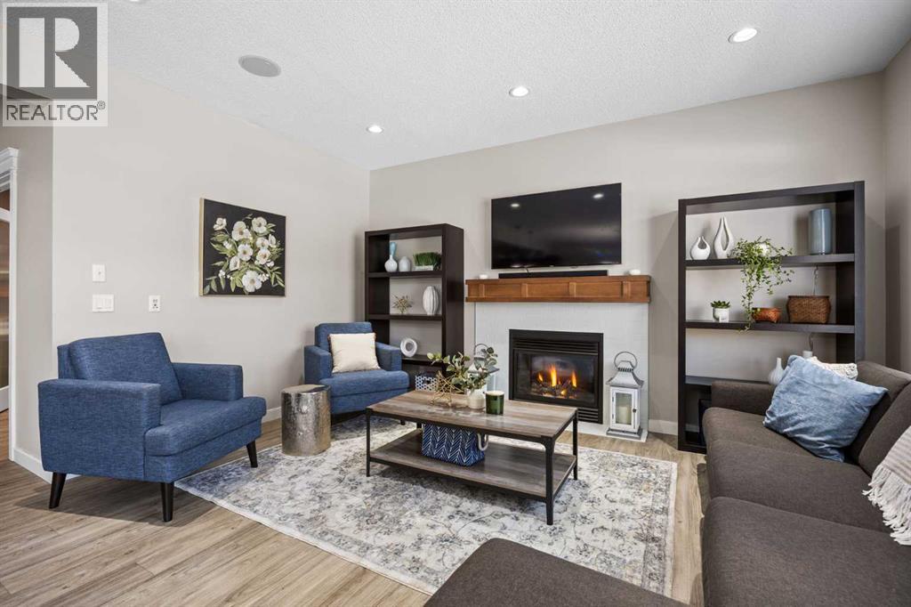 202 Royal Oak Heath Nw, Calgary, AB - Indoor Photo Showing Living Room With Fireplace