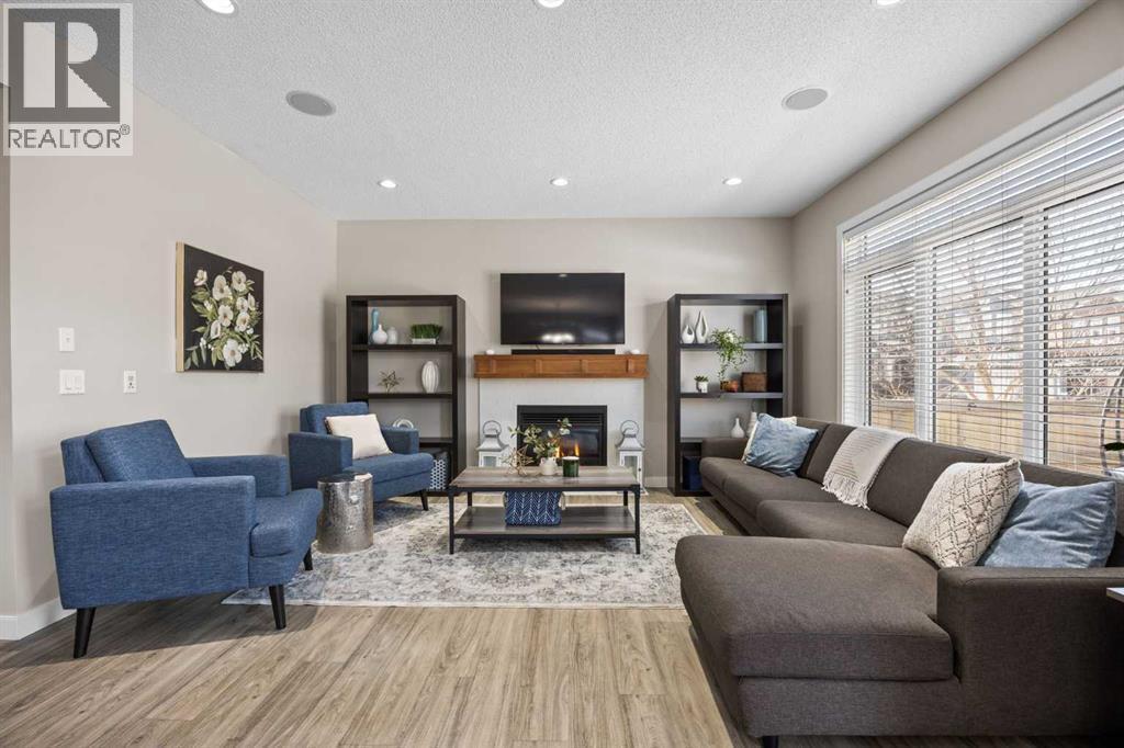 202 Royal Oak Heath Nw, Calgary, AB - Indoor Photo Showing Living Room With Fireplace