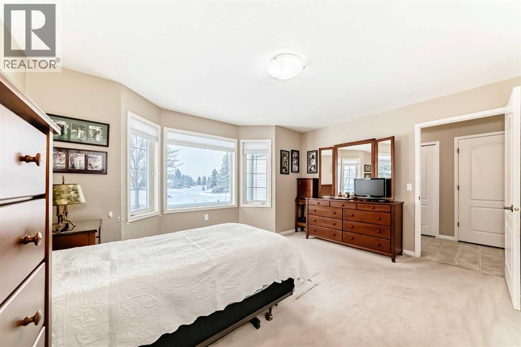 Primary Bedroom - 417 Hope Bay, Rural Rocky View County, AB - Indoor Photo Showing Bedroom