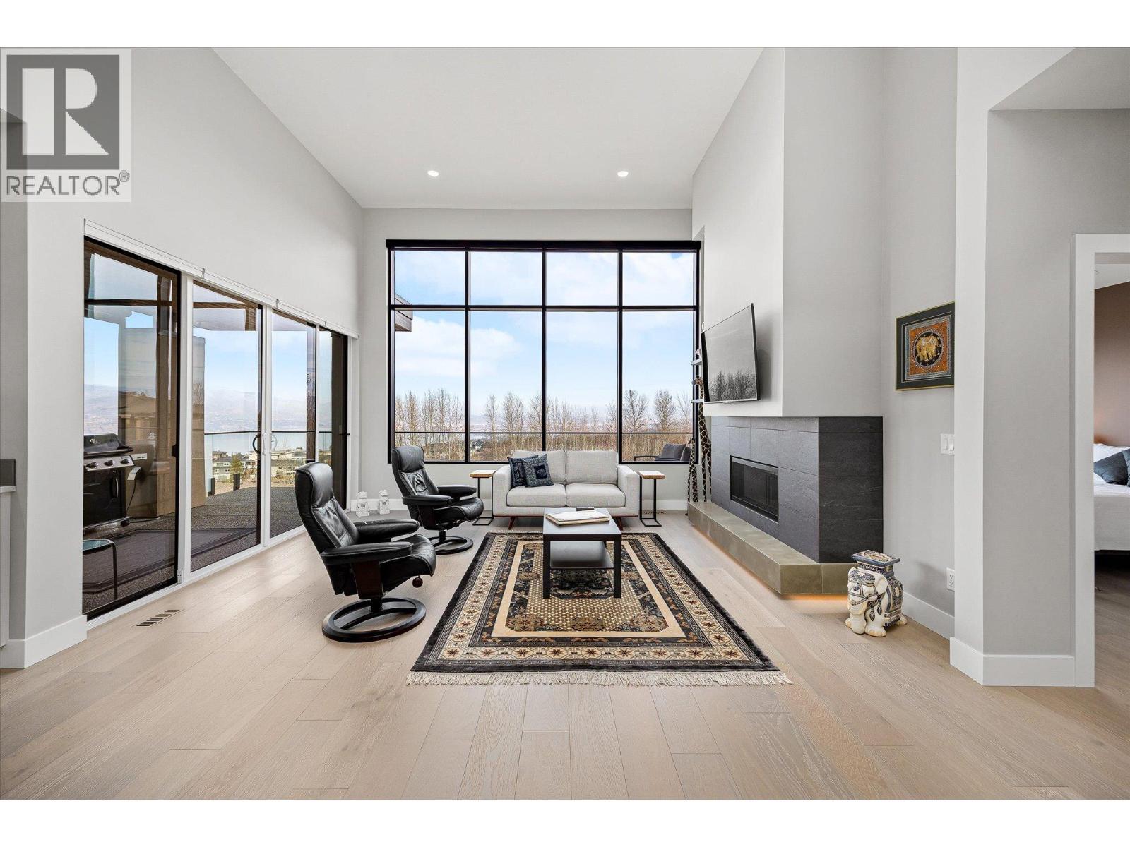 Great Room with stunning lake & city views, soaring 13ft+ ceilings and white oak floors - 468 Sparrow Hawk Court, Kelowna, BC - Indoor