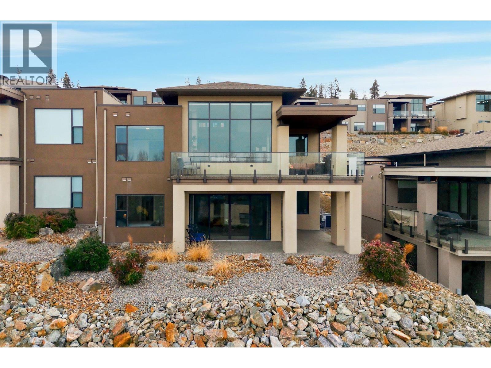 Low-maintenance, xeriscaped yard offers water-wise landscaping, complete with a timed irrigation system - 468 Sparrow Hawk Court, Kelowna, BC - Outdoor