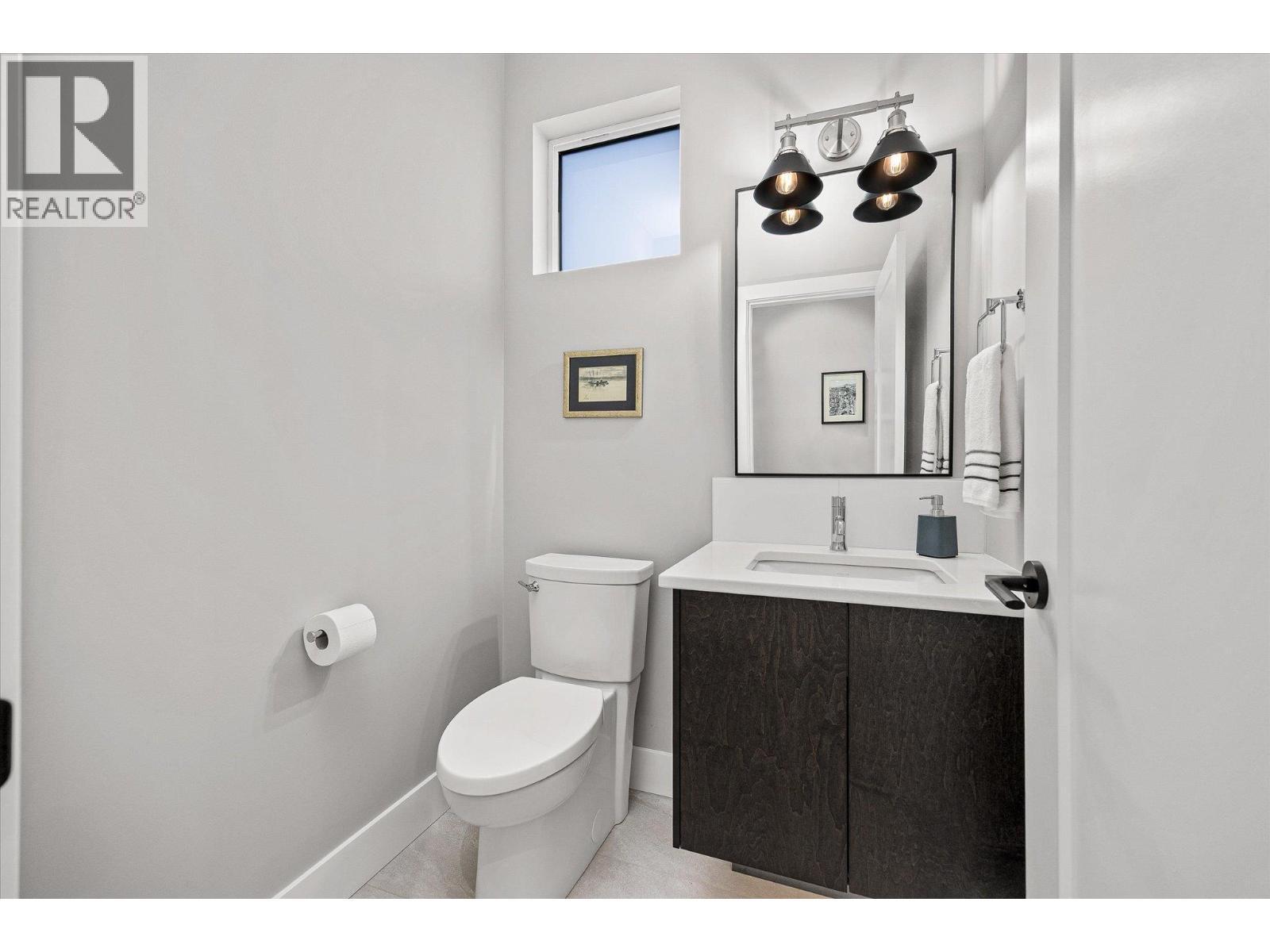 Main floor powder room - 468 Sparrow Hawk Court, Kelowna, BC - Indoor Photo Showing Bathroom