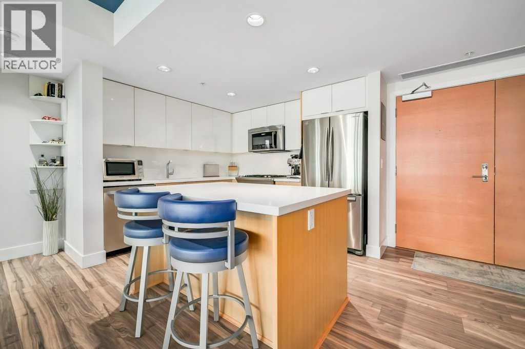 410, 560 6 Avenue Se, Calgary, AB - Indoor Photo Showing Kitchen With Stainless Steel Kitchen With Upgraded Kitchen