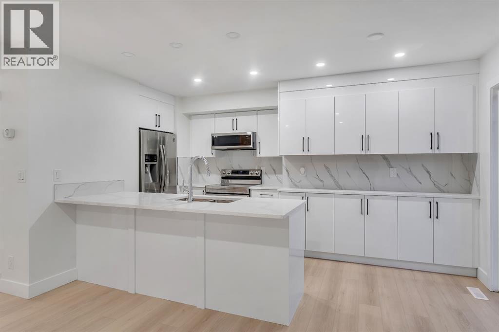 52 Saddlecreek Terrace Ne, Calgary, AB - Indoor Photo Showing Kitchen With Double Sink