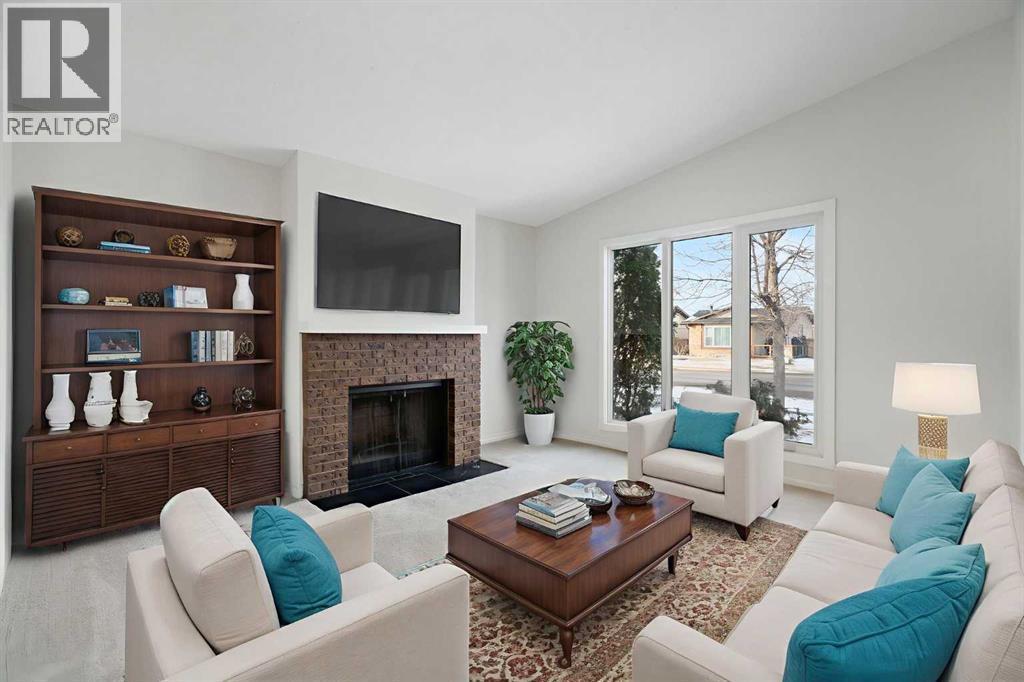 987 Berkley Drive Nw, Calgary, AB - Indoor Photo Showing Living Room With Fireplace