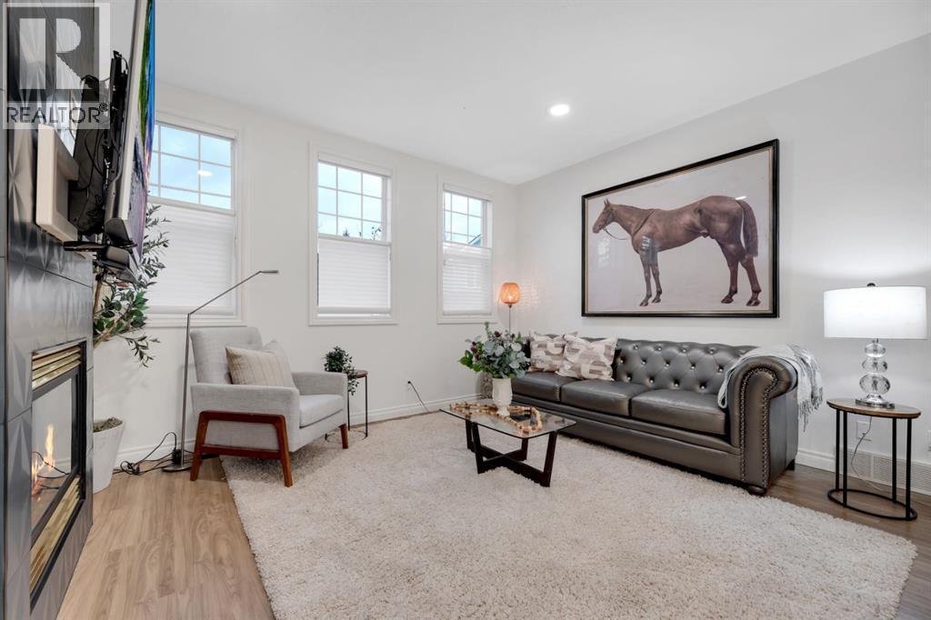 12, 10 St Julien Drive Sw, Calgary, AB - Indoor With Fireplace