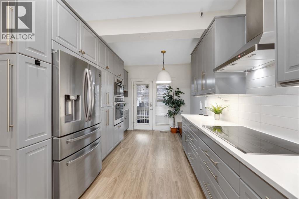 12, 10 St Julien Drive Sw, Calgary, AB - Indoor Photo Showing Kitchen With Upgraded Kitchen