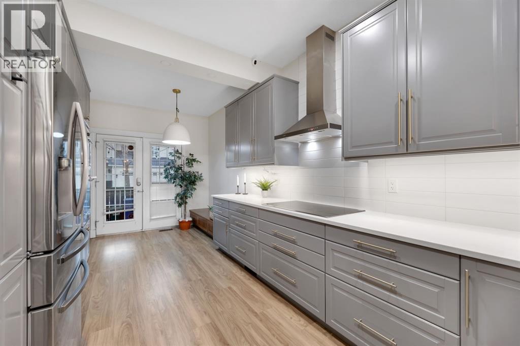 12, 10 St Julien Drive Sw, Calgary, AB - Indoor Photo Showing Kitchen With Upgraded Kitchen