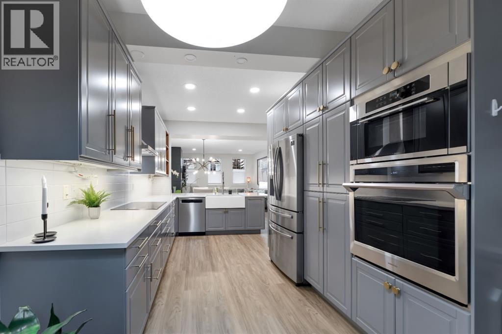 12, 10 St Julien Drive Sw, Calgary, AB - Indoor Photo Showing Kitchen With Upgraded Kitchen