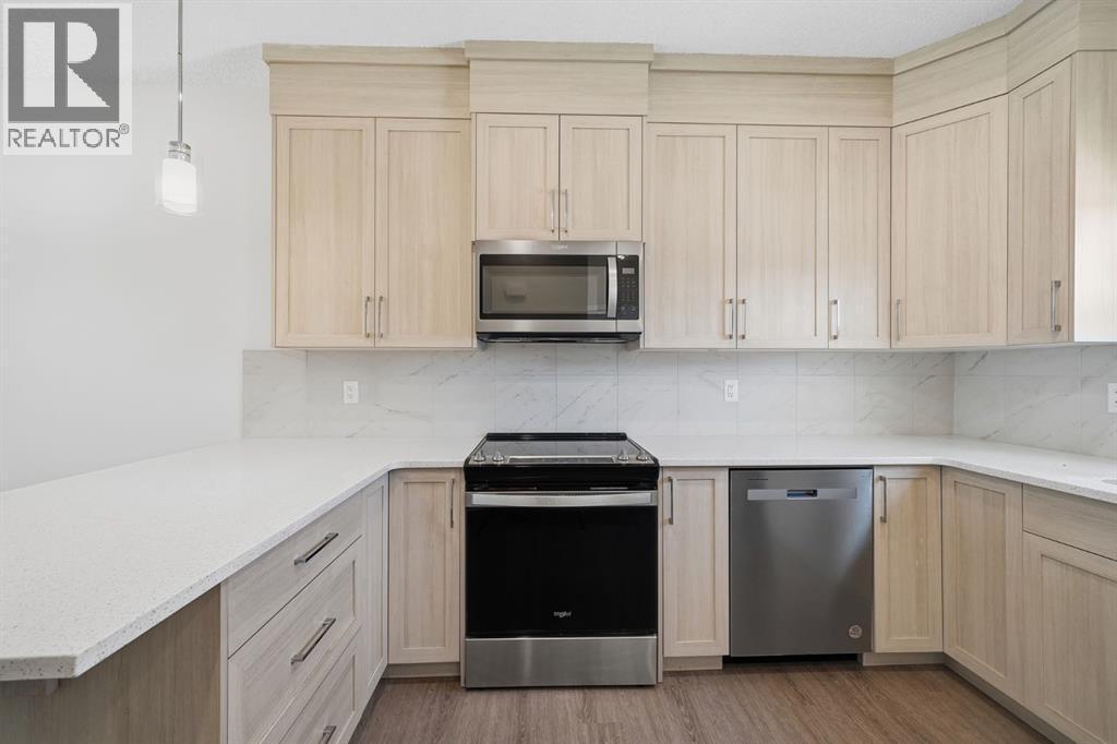 Cabinets to ceiling - 292 Cornerbrook Drive Ne, Calgary, AB - Indoor Photo Showing Kitchen