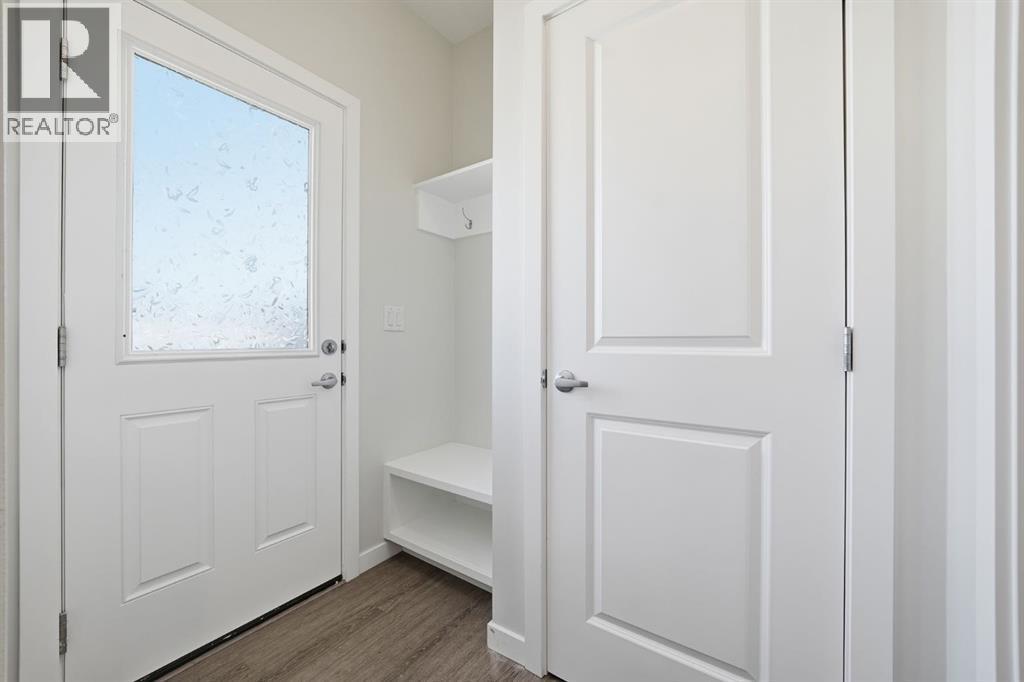 Back Entrance with Bench - 292 Cornerbrook Drive Ne, Calgary, AB - Indoor Photo Showing Other Room