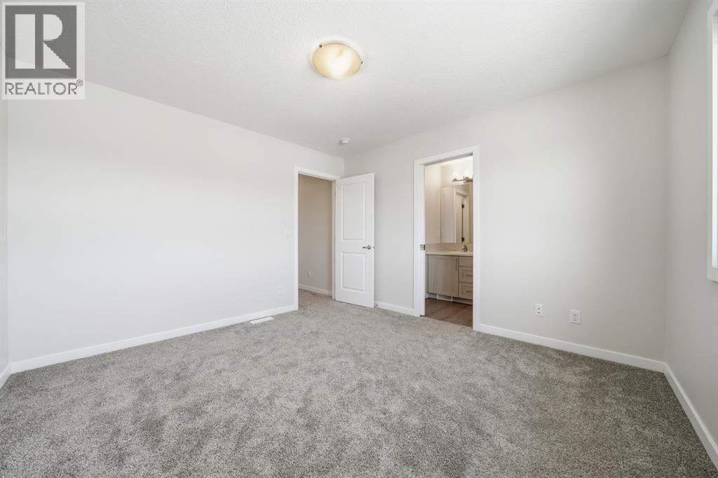 Master Bed - 292 Cornerbrook Drive Ne, Calgary, AB - Indoor Photo Showing Other Room