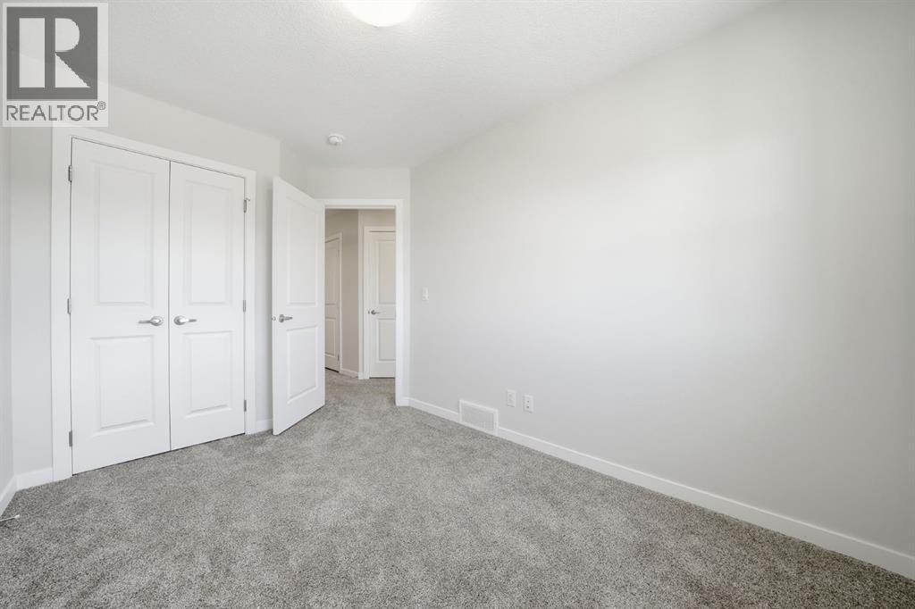Bed Closet - 292 Cornerbrook Drive Ne, Calgary, AB - Indoor Photo Showing Other Room