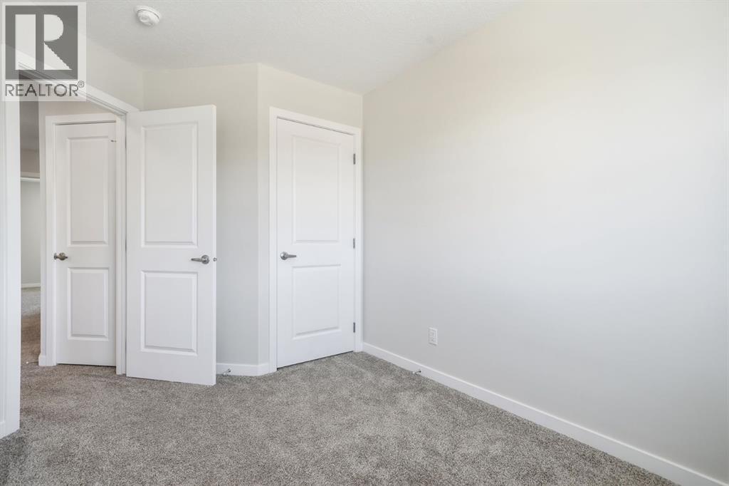 Bed Closet - 292 Cornerbrook Drive Ne, Calgary, AB - Indoor Photo Showing Other Room