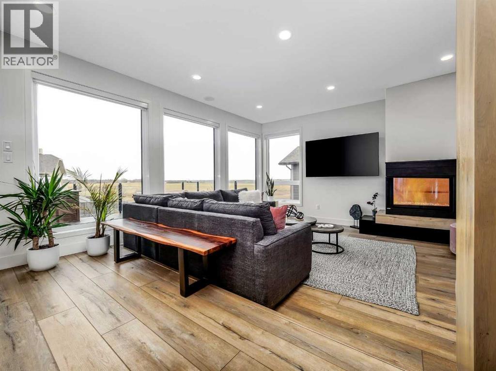 19 Stonecrest Point W, Lethbridge, AB - Indoor Photo Showing Living Room With Fireplace
