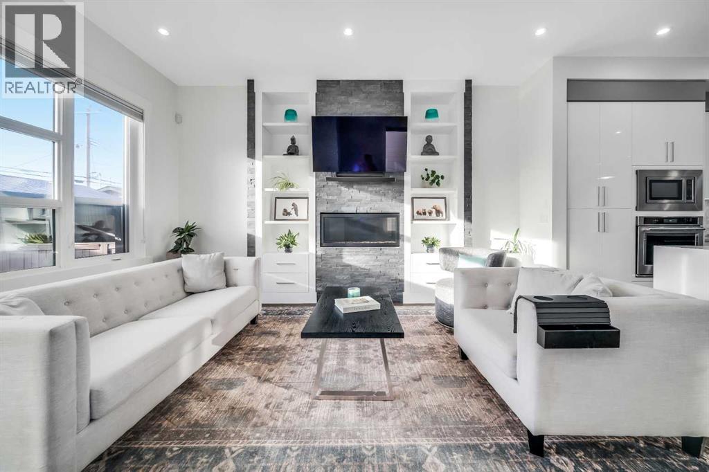 2415 25 Avenue Nw, Calgary, AB - Indoor Photo Showing Living Room With Fireplace