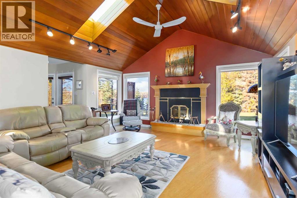 39 Poplar Crescent, Gregoire Lake Estates, AB - Indoor Photo Showing Living Room With Fireplace