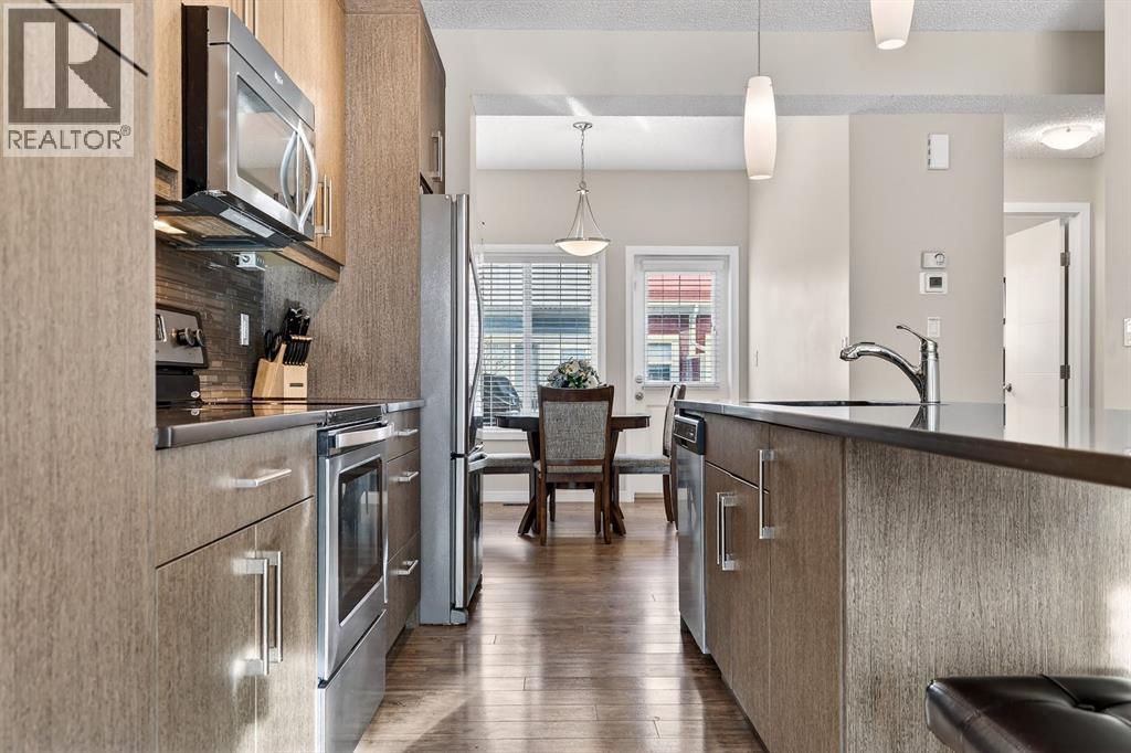 Upgraded cabinets - 330 Marquis Lane Se, Calgary, AB - Indoor Photo Showing Kitchen With Upgraded Kitchen