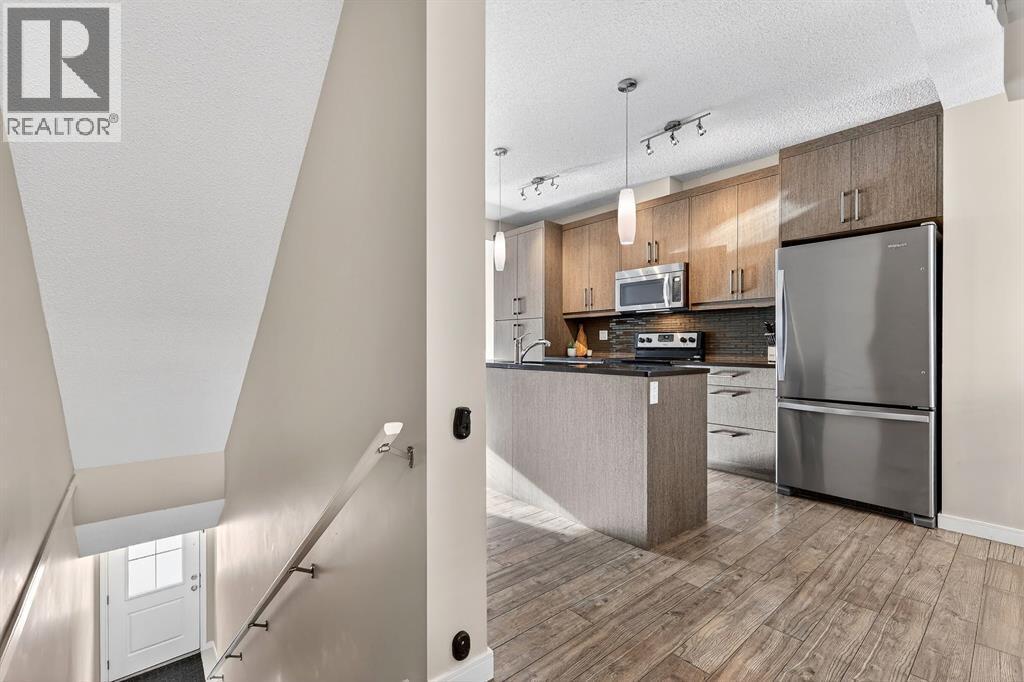 330 Marquis Lane Se, Calgary, AB - Indoor Photo Showing Kitchen With Stainless Steel Kitchen