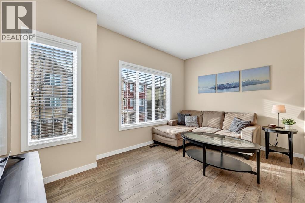 Large windows/tons of natural light - 330 Marquis Lane Se, Calgary, AB - Indoor Photo Showing Living Room