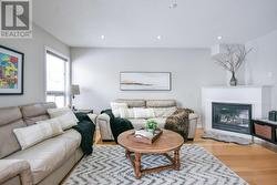 Open concept family room with gas fireplace. -