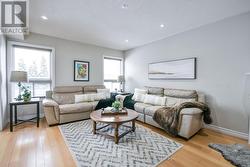 Open concept family room with hardwood floors. -