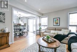 Open concept family room with hardwood floors. -