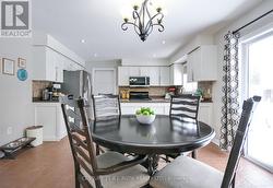 Dining area with walk out to patio. -