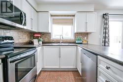 Kitchen with stainless steel appliances. -