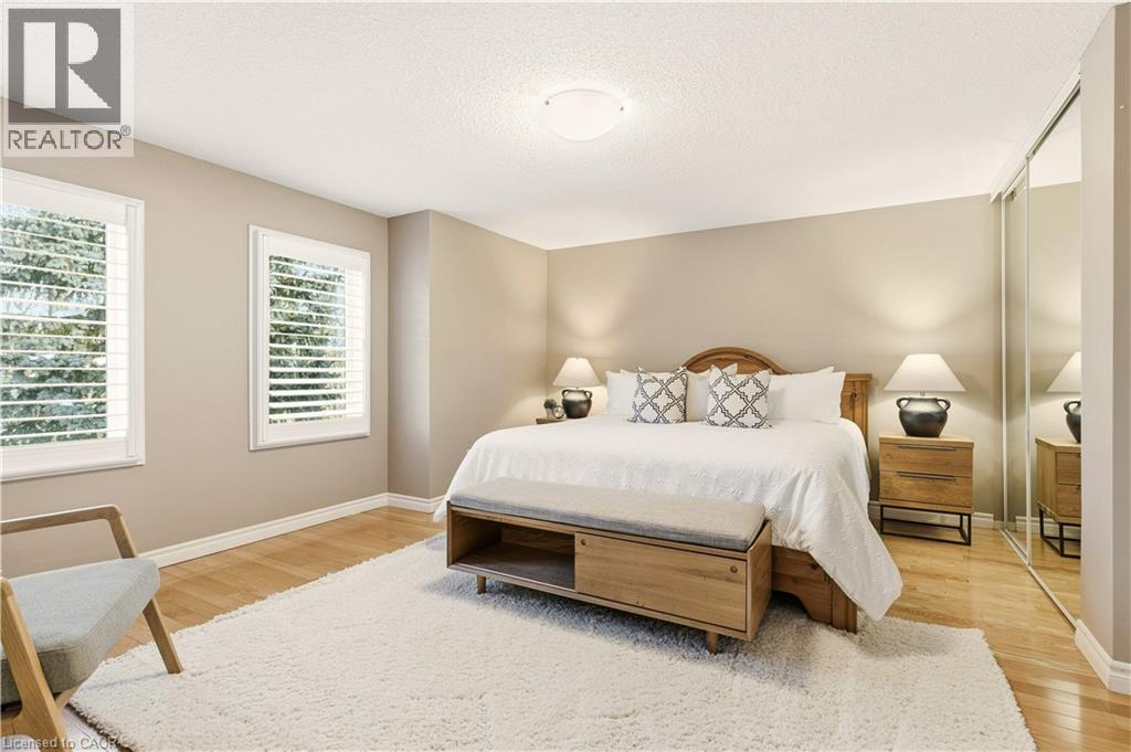 Bedroom with a closet, a textured ceiling, and light wood-style flooring - 1489 Litchfield Road, Oakville, ON - Indoor Photo Showing Bedroom