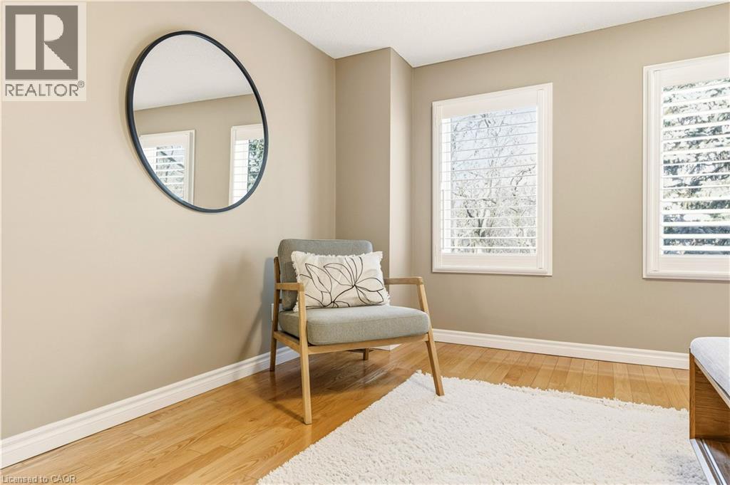 Living area with light wood-type flooring and baseboards - 1489 Litchfield Road, Oakville, ON - Indoor Photo Showing Other Room