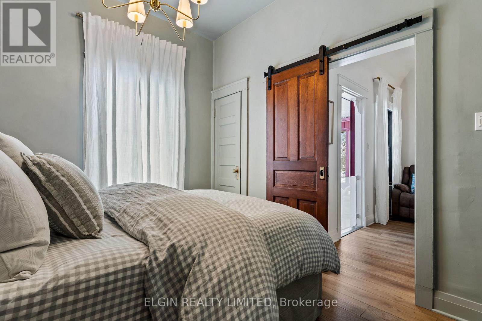 Sliding barn door and closet door - 84 Pleasant Avenue, St. Catharines (Downtown), ON - Indoor Photo Showing Bedroom