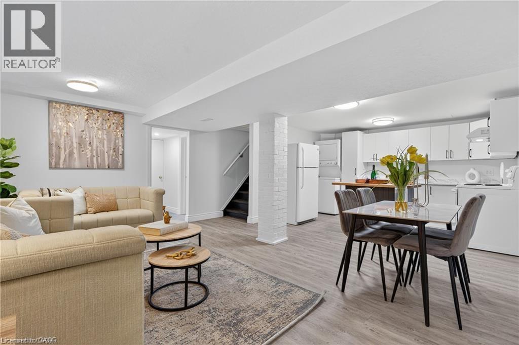 Living area with light wood-style flooring, stairs, and washer / dryer - 146 Appalachian Crescent Unit# Lower, Kitchener, ON - Indoor