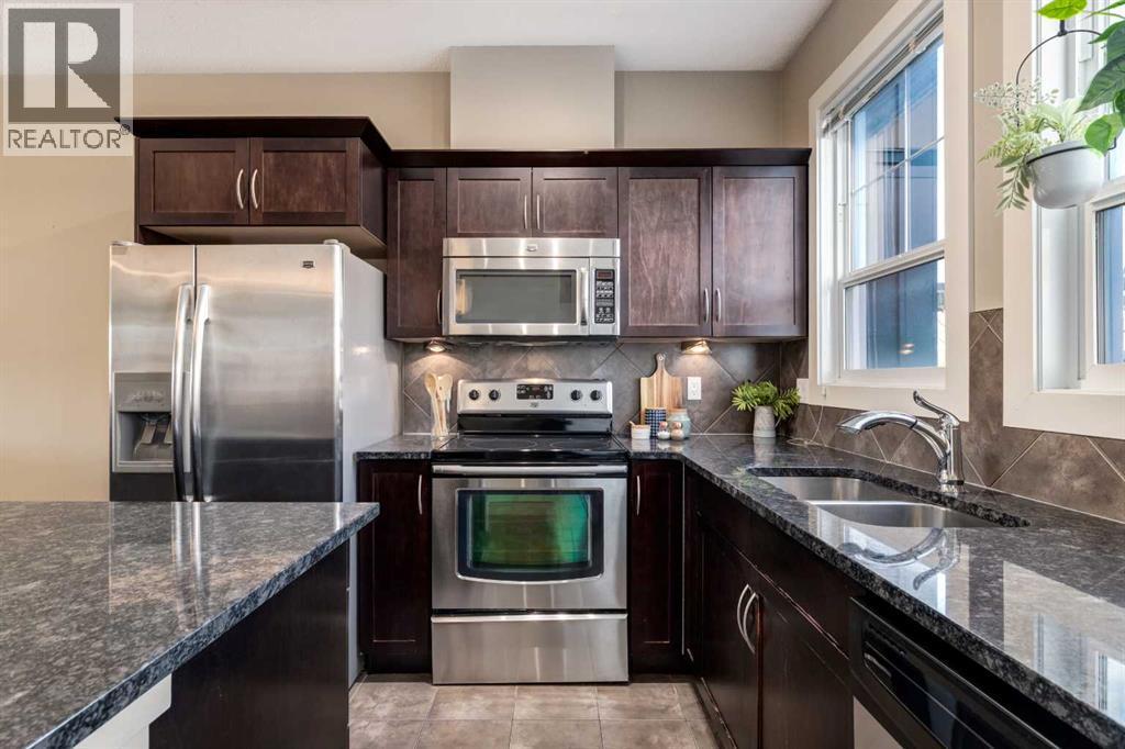 705 Evanston Square Nw, Calgary, AB - Indoor Photo Showing Kitchen With Double Sink With Upgraded Kitchen