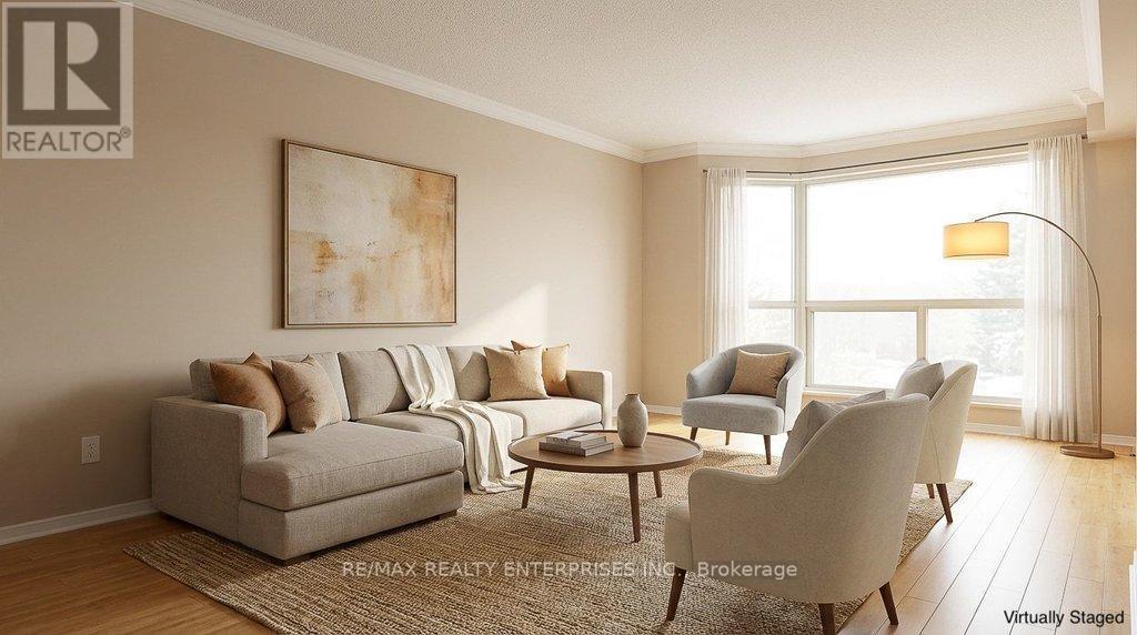 Large bright living room staged - 211 - 1800 The Collegeway, Mississauga, ON - Indoor Photo Showing Living Room
