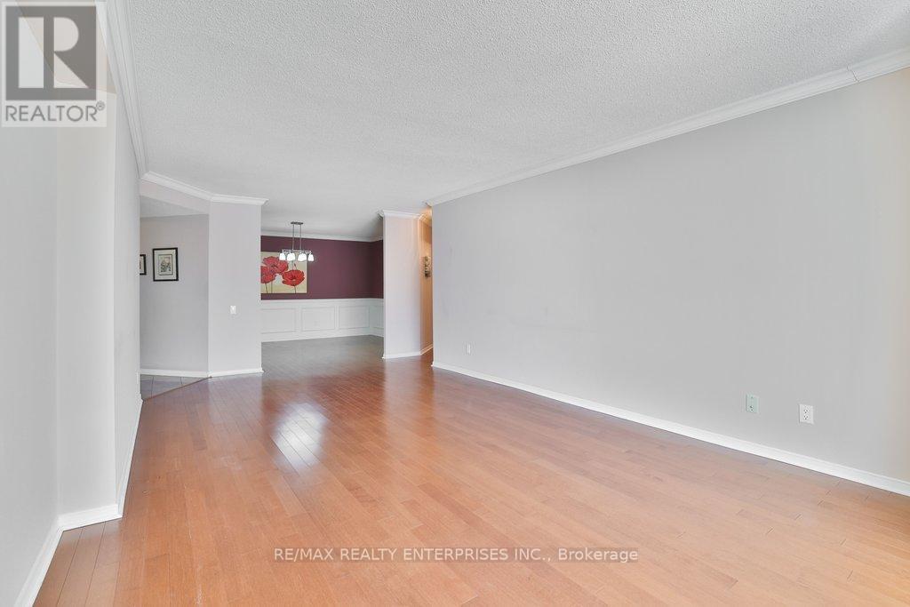 Living Opens to Dining Room - 211 - 1800 The Collegeway, Mississauga, ON - Indoor Photo Showing Other Room