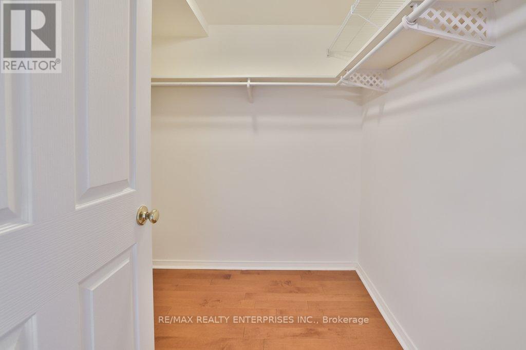 Large Primary Walk in Closet - 211 - 1800 The Collegeway, Mississauga, ON - Indoor With Storage