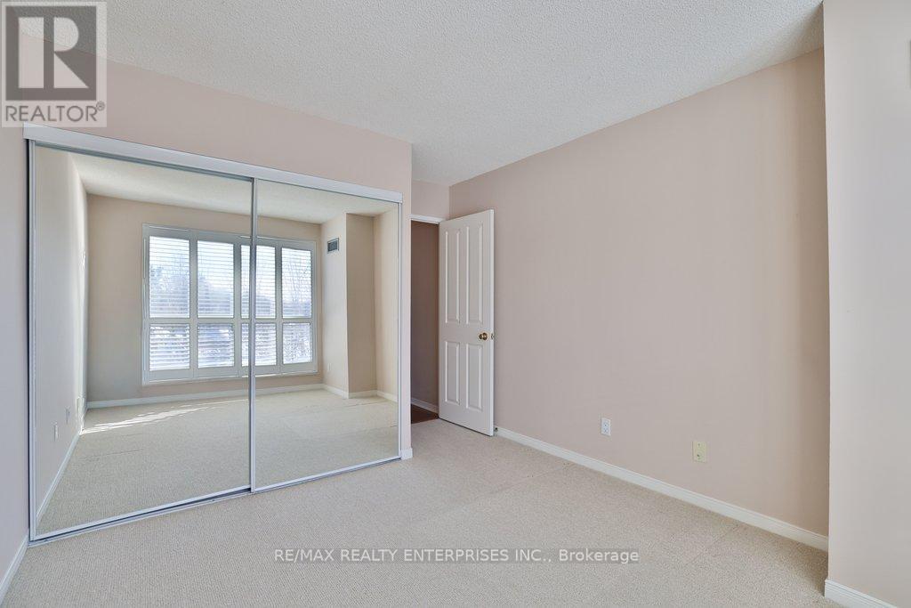 2nd bedroom with large double closet - 211 - 1800 The Collegeway, Mississauga, ON - Indoor Photo Showing Other Room