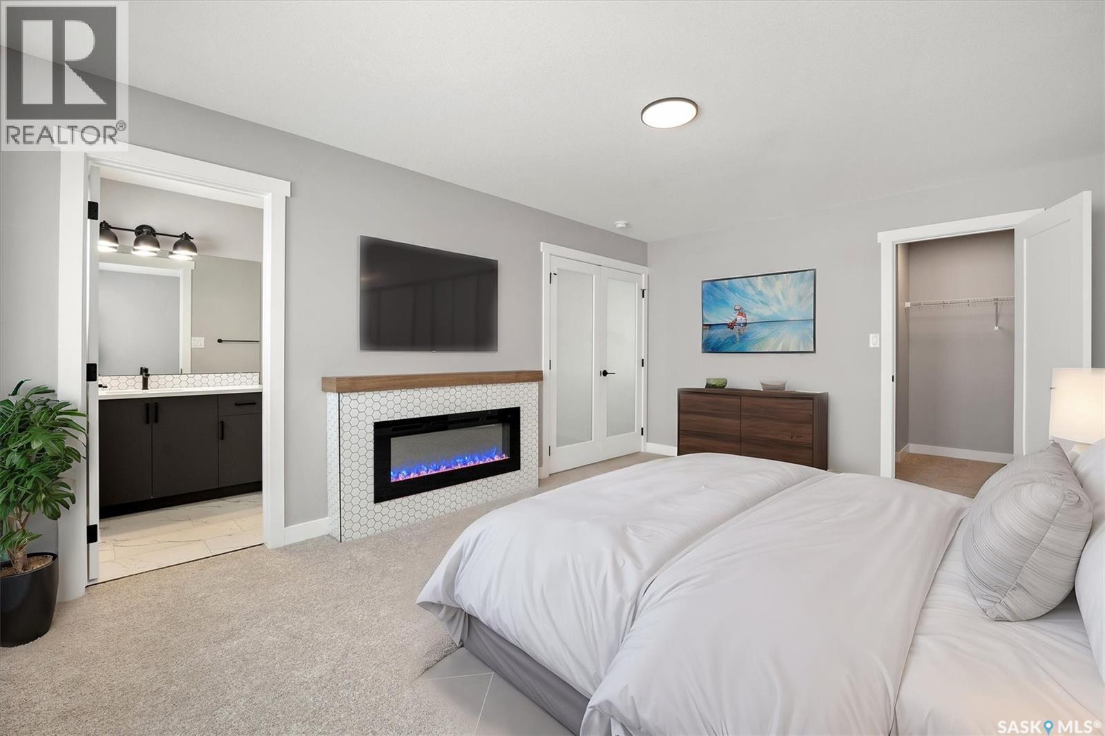 411 Yuel Crescent, Saskatoon, SK - Indoor Photo Showing Bedroom With Fireplace