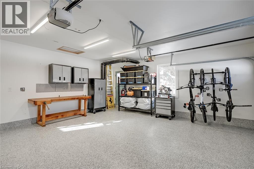 Garage featuring a garage door opener - 4226 Dunvegan Road, Burlington, ON - Indoor Photo Showing Garage