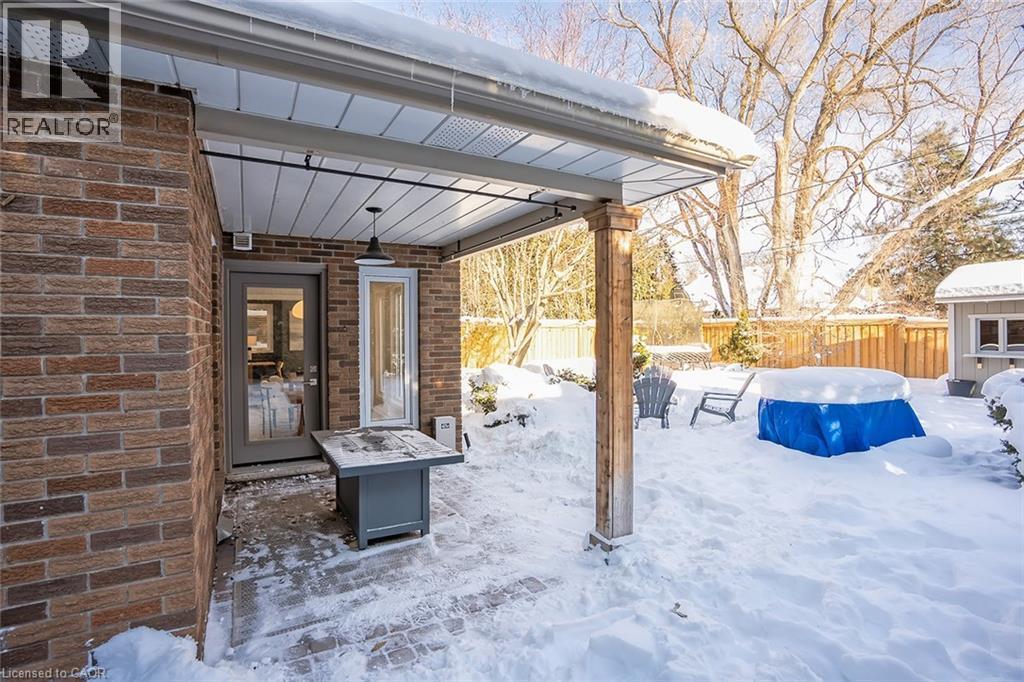Snow covered patio with a patio area - 4226 Dunvegan Road, Burlington, ON - Outdoor