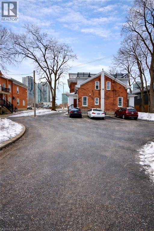 View of asphalt road with curbs - 46 College Street, Kitchener, ON - Outdoor