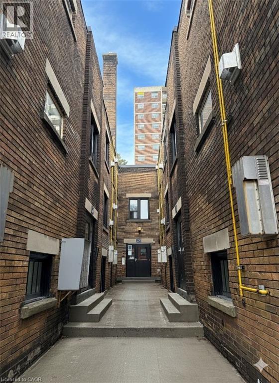 View of apartment building / complex - 46 College Street, Kitchener, ON - Photo Showing Other Room With Fireplace