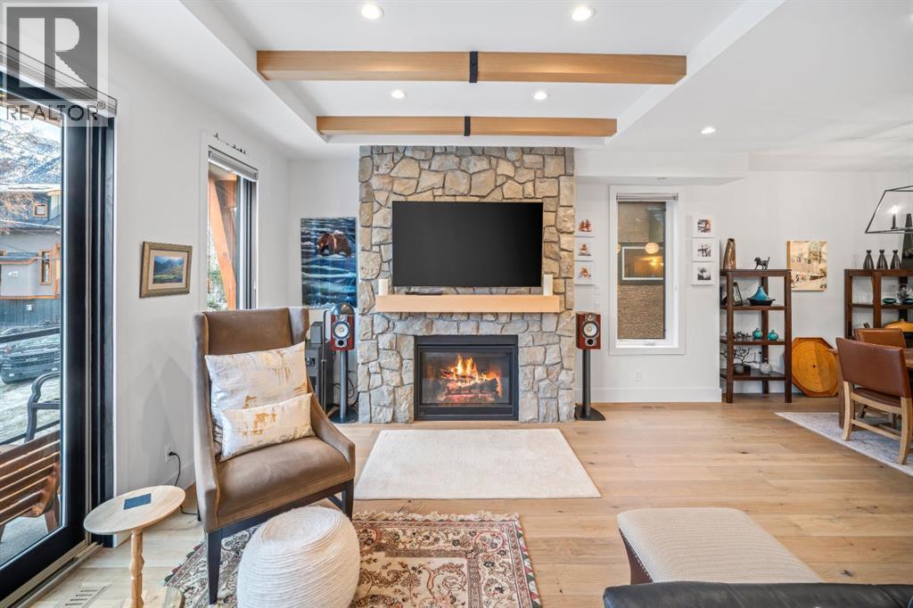 4, 810 3Rd Street, Canmore, AB - Indoor Photo Showing Living Room With Fireplace