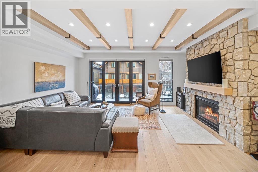 4, 810 3Rd Street, Canmore, AB - Indoor Photo Showing Living Room With Fireplace