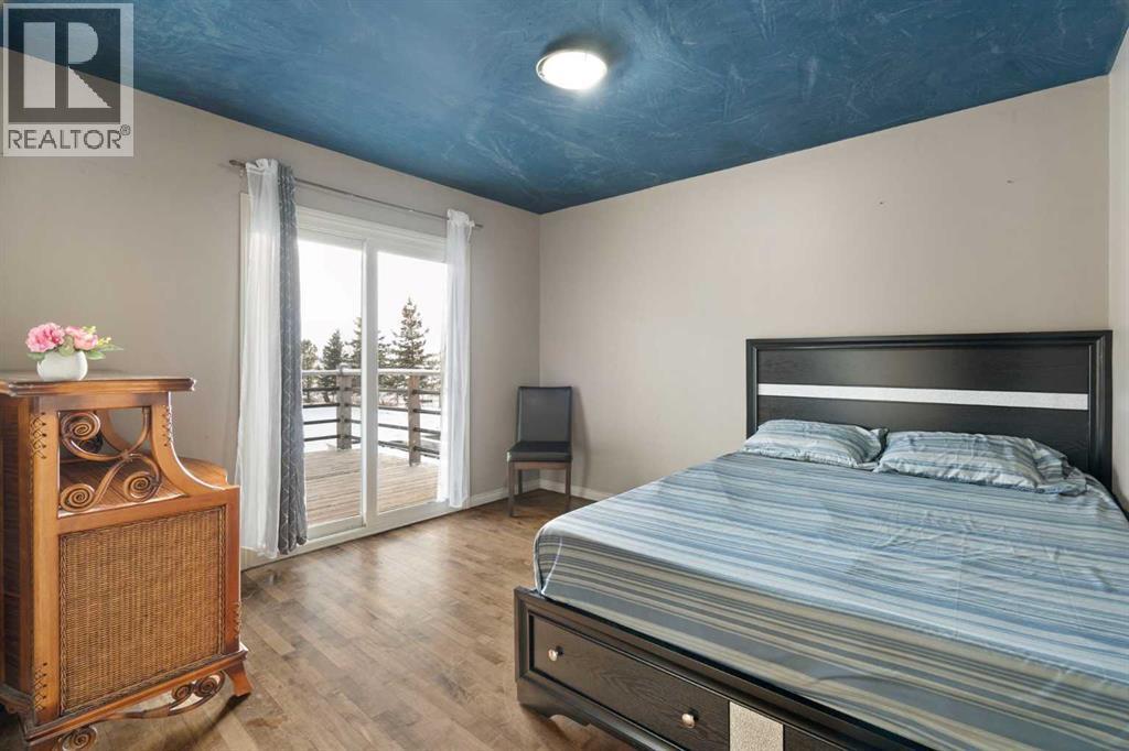 Main Floor Bedroom 1 - 284226 Township Road 254, Rural Rocky View County, AB - Indoor Photo Showing Bedroom