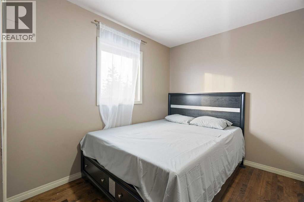 Main Floor 2nd bedroom - 284226 Township Road 254, Rural Rocky View County, AB - Indoor Photo Showing Bedroom